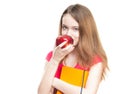 Student girl eating apple.