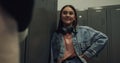 Student girl flirting classmate standing near lockers school corridor close up. Royalty Free Stock Photo