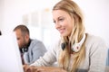 Student girl with headphones working on laptop Royalty Free Stock Photo