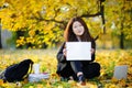 Student girl holding blank whiteboard in her hands Royalty Free Stock Photo