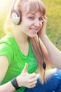 Student girl outside in park listening Royalty Free Stock Photo