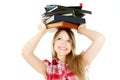 Student girl with pile of book on her head Royalty Free Stock Photo