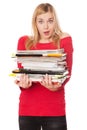 Student girl with a pile of heavy books Royalty Free Stock Photo