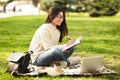 Student girl preparing for lecture using laptop Royalty Free Stock Photo