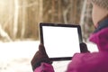 Student girl reading e-book on the bench in park. Digital tablet computer with blank isolated screen. Education background. Royalty Free Stock Photo