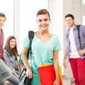 Student girl with school bag and color folders Royalty Free Stock Photo