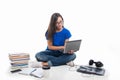 Student girl sitting holding laptop with books around Royalty Free Stock Photo