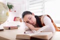 Student girl sleeping over books at desk Royalty Free Stock Photo