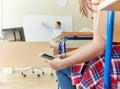 Student girl with smartphone texting at school Royalty Free Stock Photo