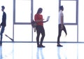 Student girl standing with laptop, people group passing by Royalty Free Stock Photo