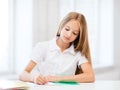 Student girl studying at school Royalty Free Stock Photo