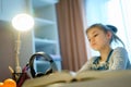 Student girl studying something using computer and headphones at home Royalty Free Stock Photo