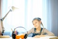 Student girl studying something using computer and headphones at home Royalty Free Stock Photo