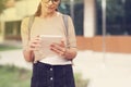 Student girl with tablet in campus