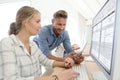 Student girl with teacher in classroom working Royalty Free Stock Photo