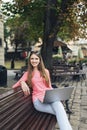 Student girl working with a laptop in old city Royalty Free Stock Photo