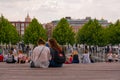 Student girls sitting on the bench, resting in the park, spring in Moscow Royalty Free Stock Photo