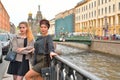 Student girls standing at the gate of the Griboyedov Canal emban Royalty Free Stock Photo