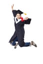 student in graduate robe jumping against white background