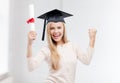 Student in graduation cap with certificate Royalty Free Stock Photo