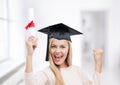 Student in graduation cap with certificate Royalty Free Stock Photo