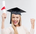 Student in graduation cap with certificate Royalty Free Stock Photo