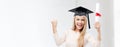 Student in graduation cap with certificate Royalty Free Stock Photo