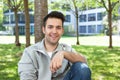 Student in a grey jacket relaxing at the campus Royalty Free Stock Photo
