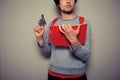 Student with gun and book Royalty Free Stock Photo