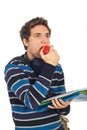 Student guy eating an apple