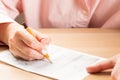 Student hand testing in exercise and passing exam carbon paper computer sheet with pencil in school test room, education concept Royalty Free Stock Photo