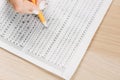 Student hand testing in exercise and passing exam carbon paper computer sheet with pencil in school test room, education concept Royalty Free Stock Photo