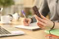 Student hands holding chocolate snack bar studying