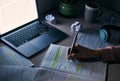 Student, hands and writing notes at night with laptop for research, education and internet project. Closeup of college Royalty Free Stock Photo