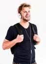 Student handsome guy listening music. Modern people concept. Man tousled hairstyle wear plastic earphones gadget. Enjoy Royalty Free Stock Photo