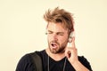 Student handsome guy listening music. Rhythmic melody concept. Download music application. Man tousled hairstyle wear Royalty Free Stock Photo