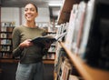 Student, happy and reading books in library for education learning or university research in bookstore. Bookshelf Royalty Free Stock Photo