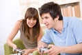 Student - happy teenagers playing video game Royalty Free Stock Photo