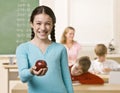 Student holding apple