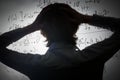 Student holding his head looking at complex math formulas on whiteboard. Problem to solve Royalty Free Stock Photo