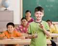 Student holding molecular model in classroom