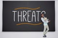 Student holding pile of books against threat Royalty Free Stock Photo