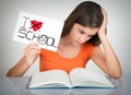 Student holding a sign with the words I hate school Royalty Free Stock Photo