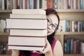 Student holding thick books