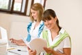 Student at home - two happy woman with laptop Royalty Free Stock Photo