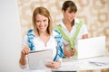 Student at home - two happy woman with laptop Royalty Free Stock Photo