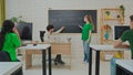 Student and Instructor Discuss Python Code in Modern Classroom