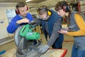 student in ironworks class using circular saw Royalty Free Stock Photo