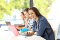 Student with laptop posing in a classroom Royalty Free Stock Photo