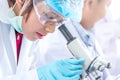 Student learning chemistry. Positive joyful smart boy testing and using a microscope in science class. Boy play attention in scien Royalty Free Stock Photo